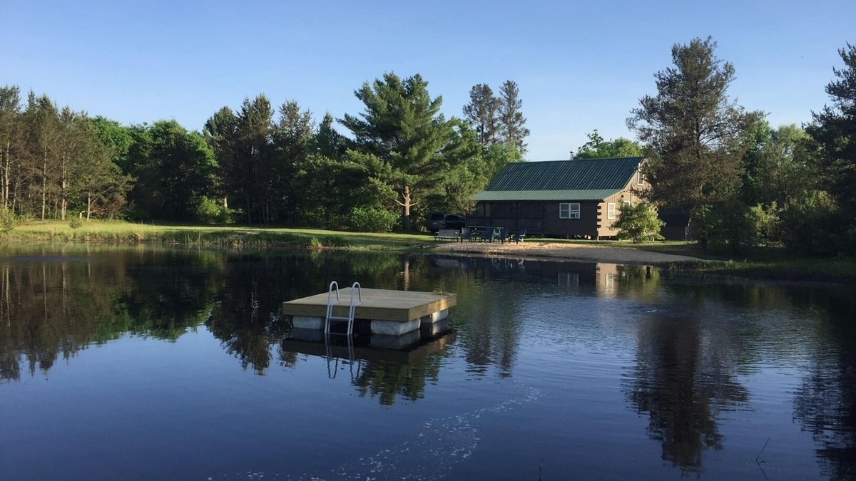 Sparta Cabin | Secluded family-friendly log cabin with swimming pond. Charm, comfort.