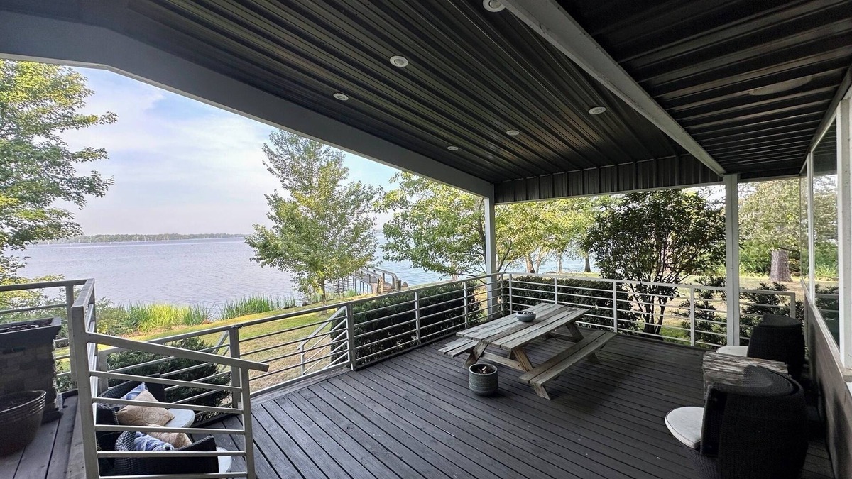 Lafayette County House | Secluded getaway with lakefront views. Spacious covered deck and dock access.
