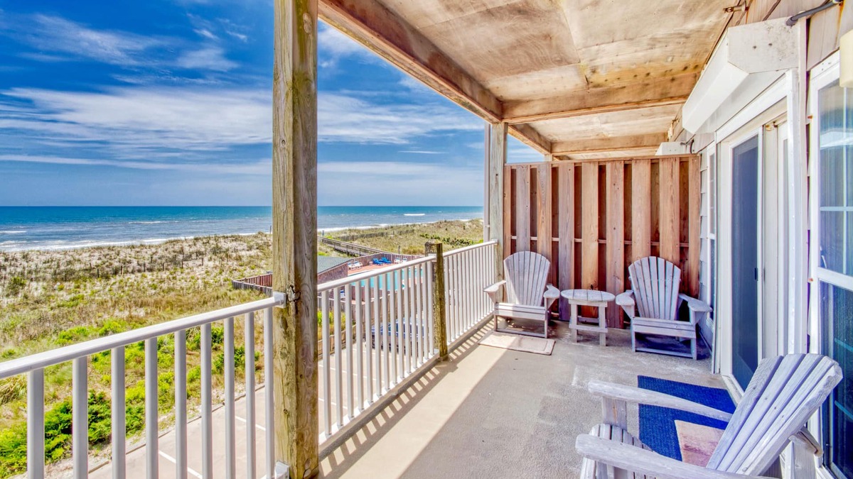 Hatteras Condo | Second-floor oceanfront home with outdoor pool, hot tub, pool table, & W/D