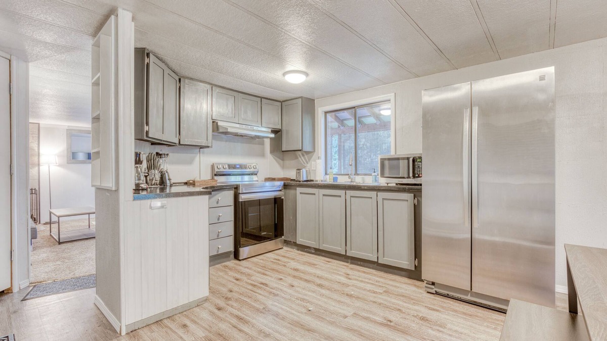 Sandy House | Serene home with large outdoor deck, beautiful forest views, firepit & gas grill
