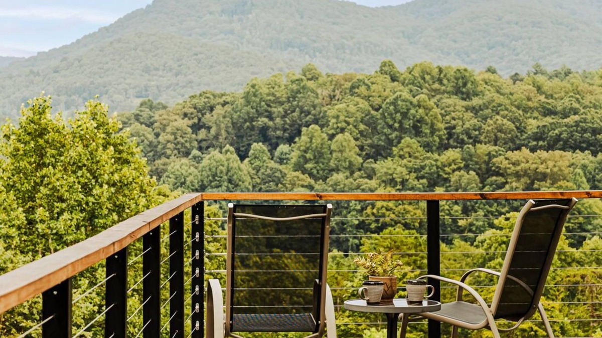 Young Harris Cabin | Serenity Now is a 4BR/3.5BA mountain retreat where fall shines. Gather by the gas fireplace, share meals in open living spaces, and relax on a large deck with sweeping views and changing leaves. Perfect for families, friends, or couples.
