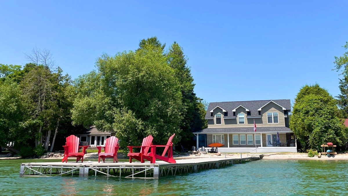 Big Bay Point Cottage | Shallow Beach Lakefront Cottage perfect with Kayak, Firepit, BBQ + Playground