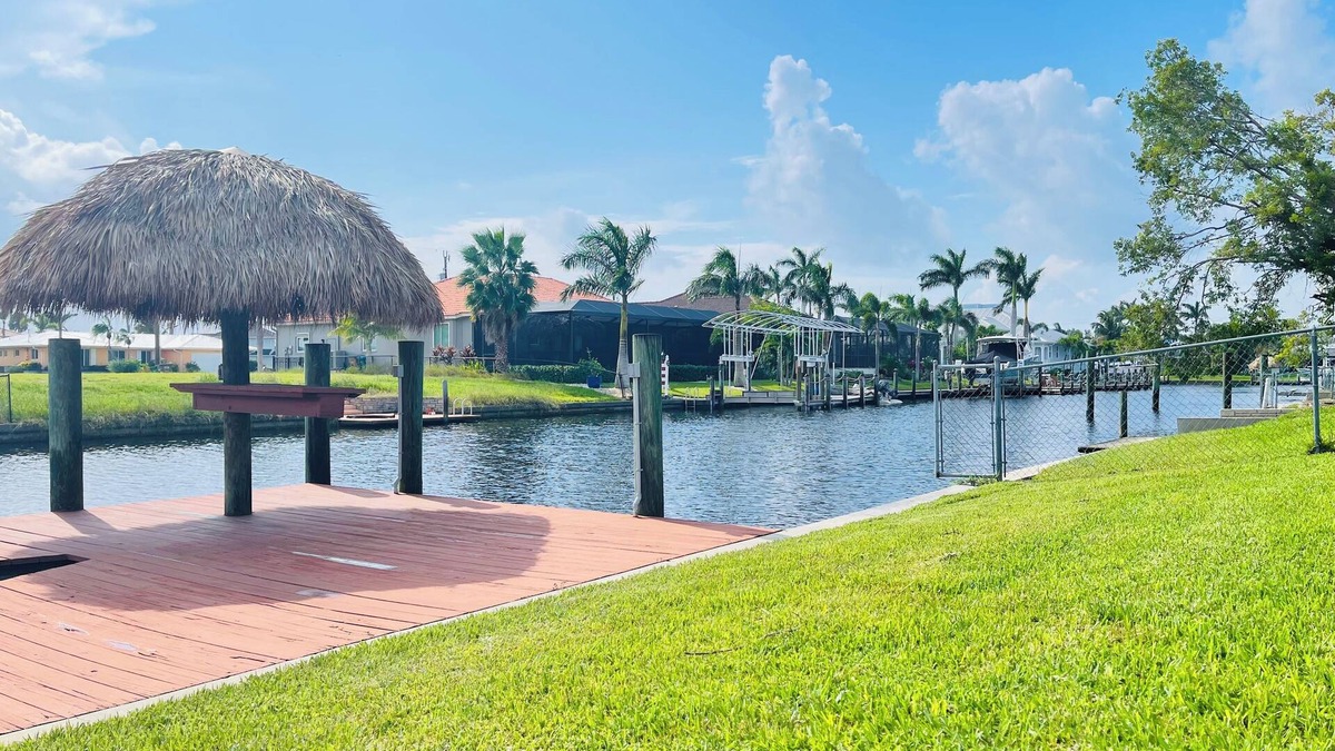 Eight Lakes House | Short Distance From Tarpon Point Marina! Gulf Access, Heated Pool, Dock & Tiki!