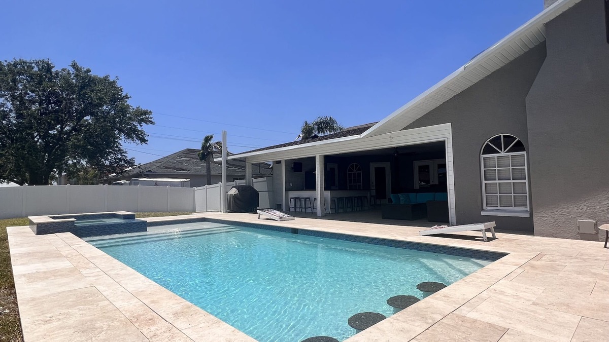 Caloosahatchee House | Sleeps 20! Heated Pool & Spa! Unique huge home. Great for large groups!