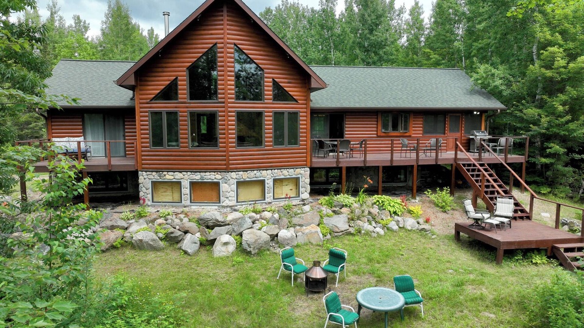 Cook House | Snowmobile Retreat with Trailer Parking, Screen Porch, Sauna, 3 Bedrooms & Loft.