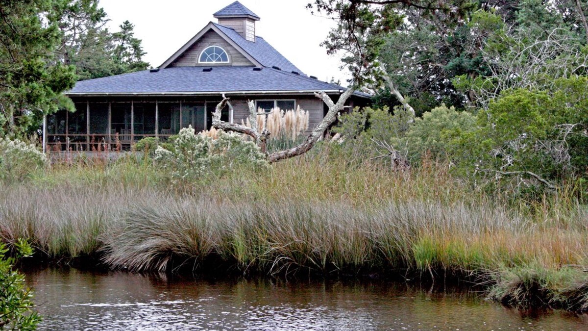 Ocracoke House | Southern Comfort: Pet Friendly, tucked among live oaks, salt marsh views.