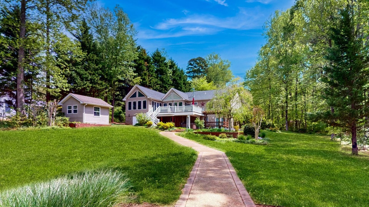 Lakeside Woods House | Spacious lakefront house w/private hot tub, deck, fire pit & grill