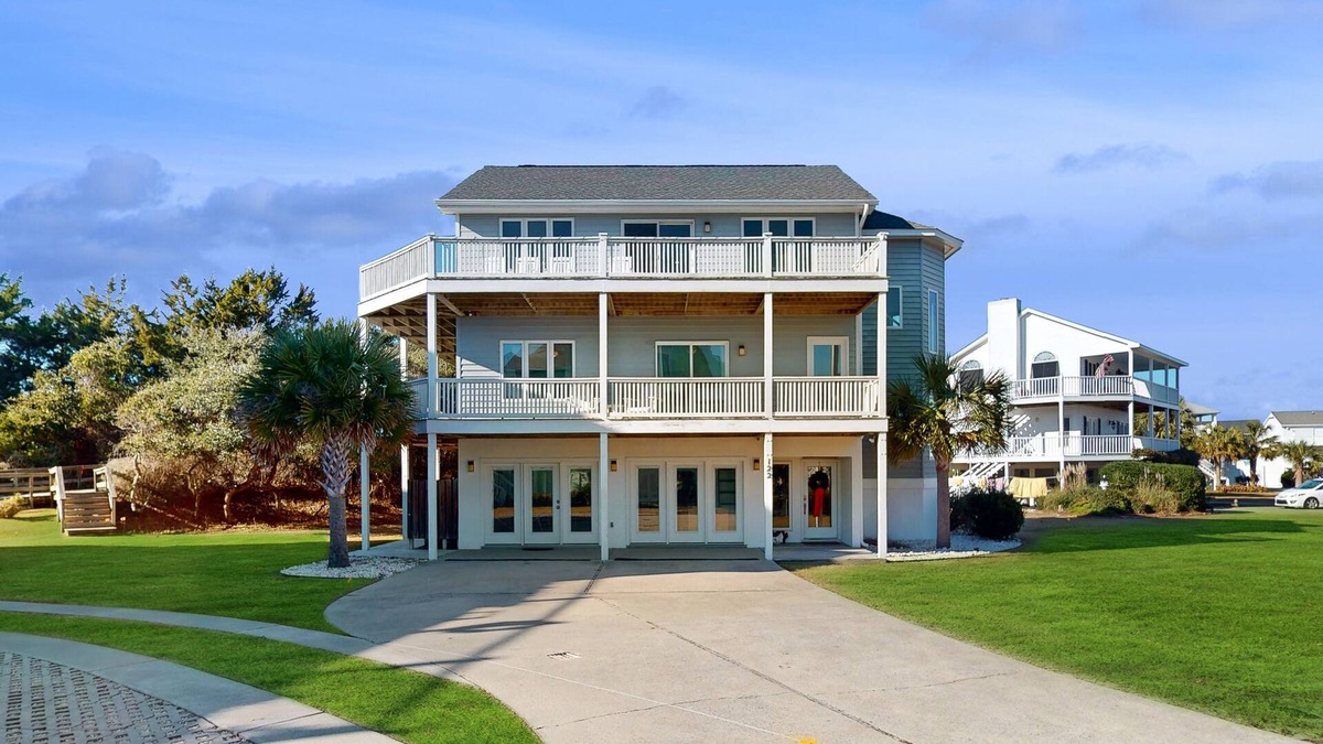 Island Quay House | Spacious & sophisticated beach retreat with balcony, games, W/D, & ocean views