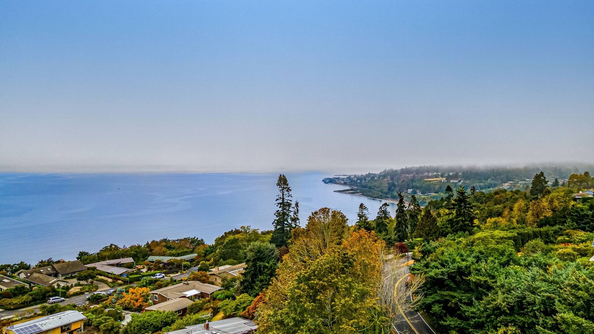 Innis Arden House | Spectacular mid-century home with two-story fireplace, huge deck, & water views