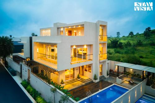 Khodala Villa | StayVista at Amara Palms