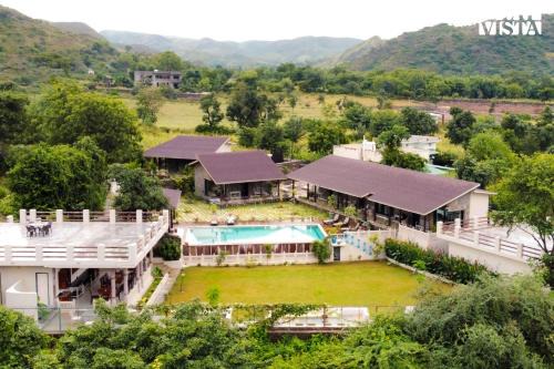 Udaipur District Villa | StayVista at The Earthen Boutique with Spacious Pool, Terrace, Lawn & Games