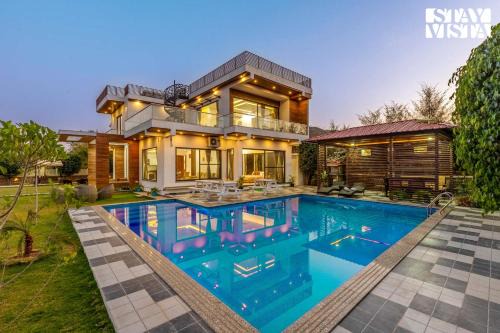 Bedla Villa | StayVista's Bella Dream - Mountain-View with Outdoor Pool, Lawn featuring a Gazebo & Indoor Games