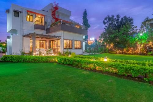 Khandala Villa | StayVista's Fairfield Villa - A green lawn and charming orchard await your retreat