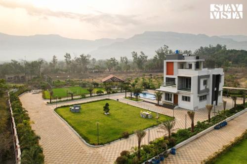 Karjat Villa | StayVista's Oasis Of Solace - Mountain-View Villa with Pool Deck, Kids Zone, Turf & Gazebo