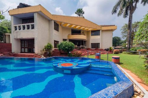 Khandala Villa | StayVista's Shantam House - Dive into relaxation with a pool and tennis lawn