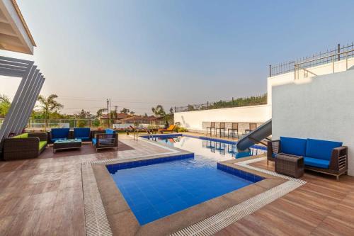 Kune Village Villa | StayVista's White Pebbles - A Villa with Theater Room & Swimming Pool