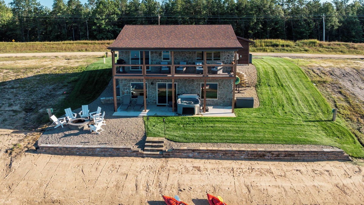 New Lisbon Cottage | Stone Cottage - Lakefront/Beach/Arcade/HotTub/MassageChair/2 Kings/Near WI Dells