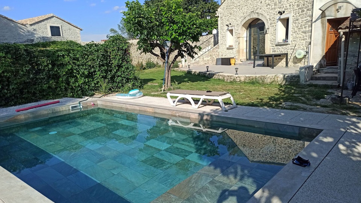 Fontanes House | Stone house renovated in a contemporary style with garden and swimming pool.