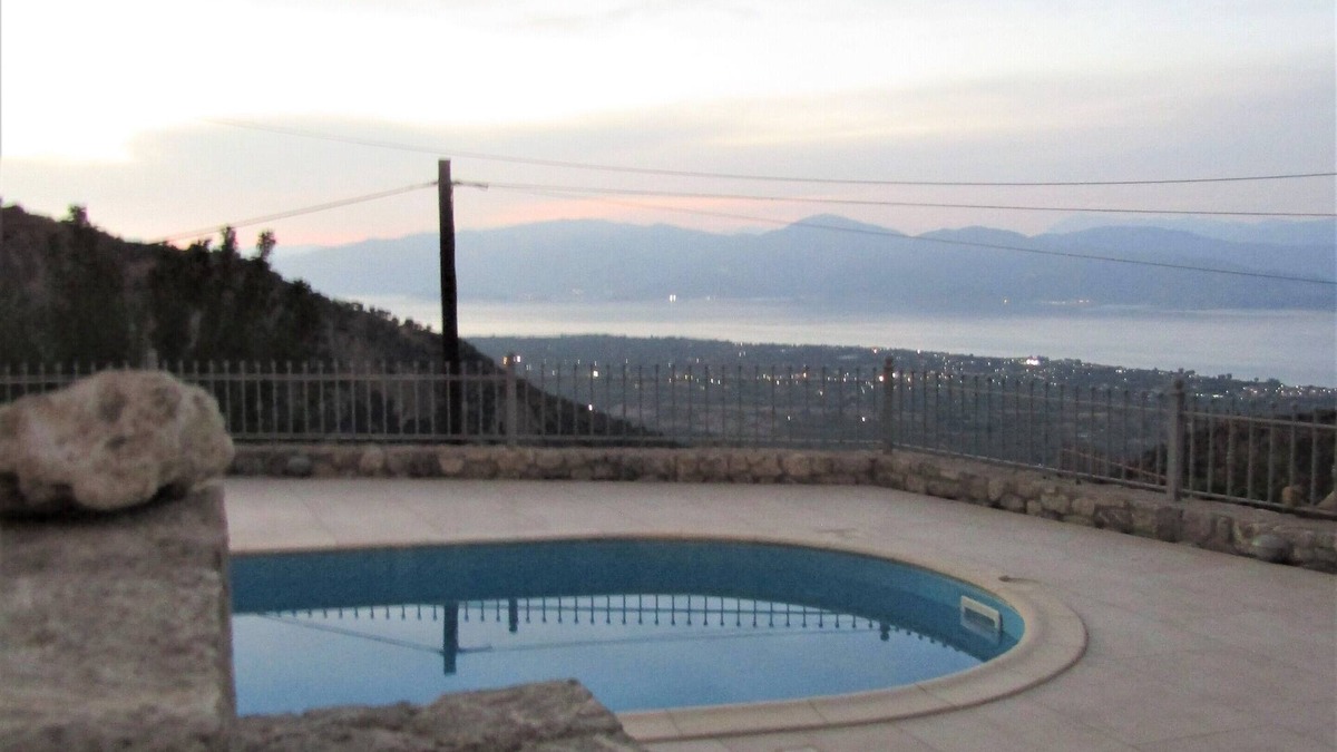 Keryneia House | Stone house with pool and view to the sea