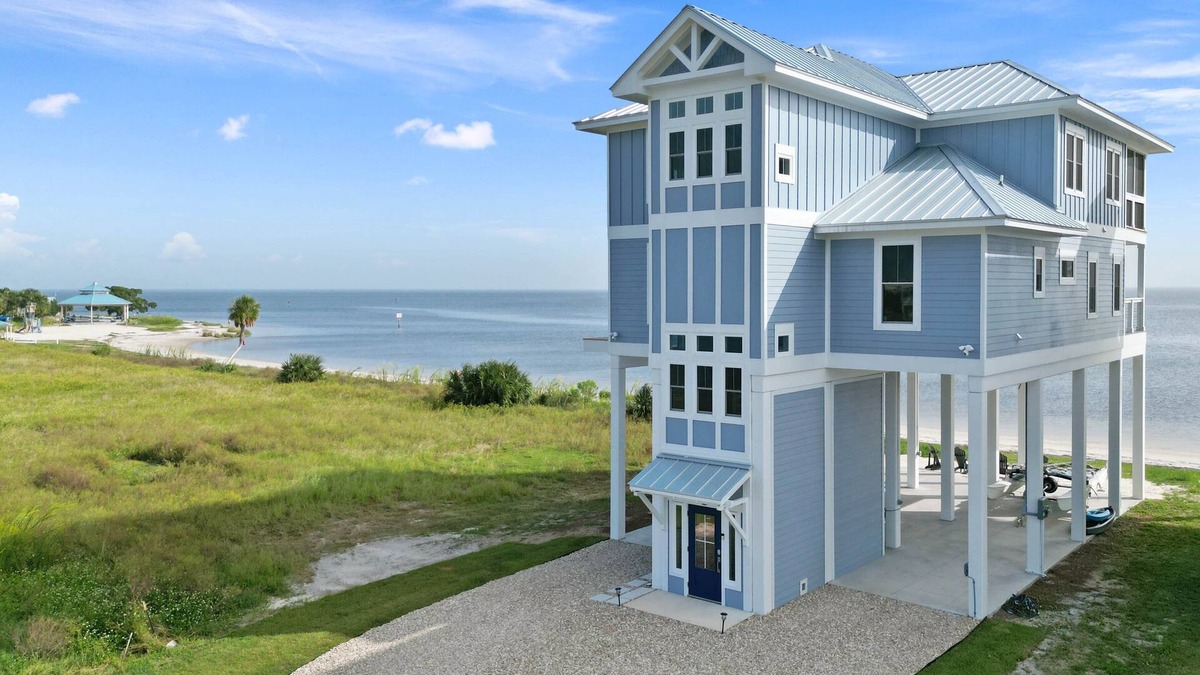 Crawfordville House | Stunning new beach house right on the sand, with use of private boat dock.