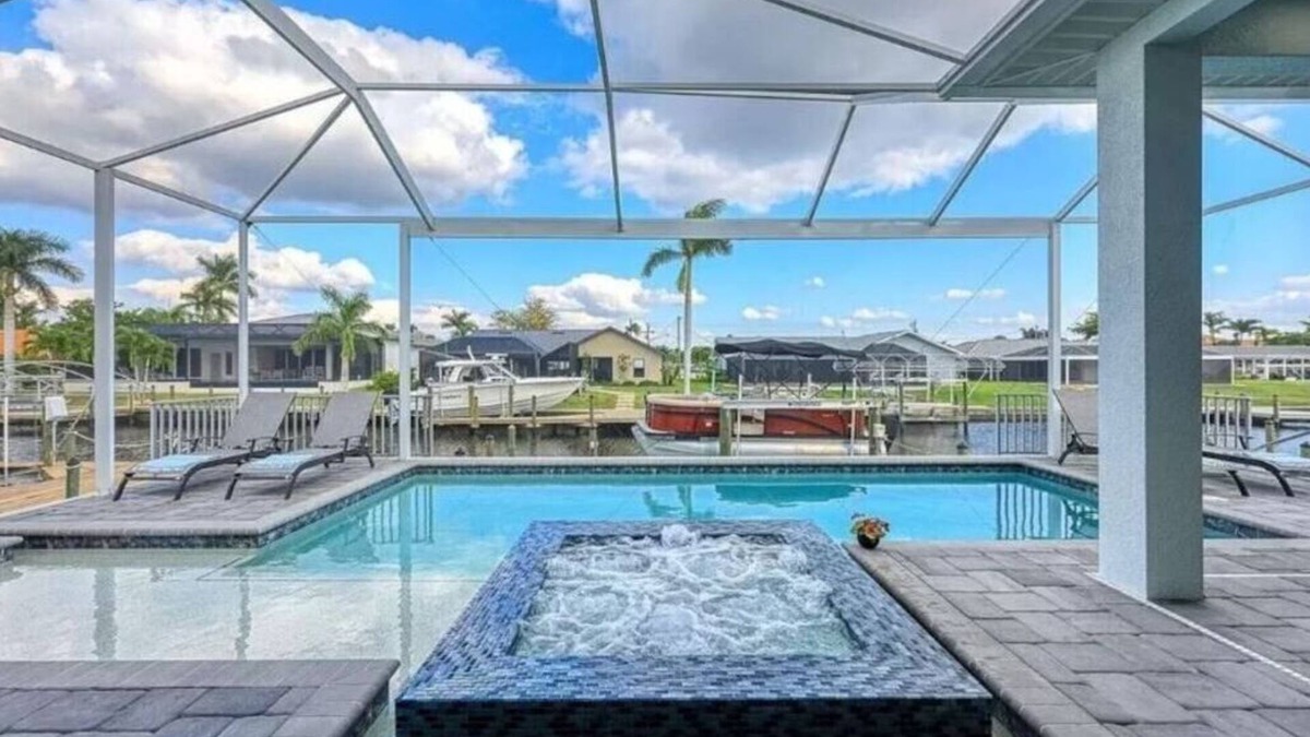 Eight Lakes House | Stunning New Waterfront Luxury Villa with oversized Heated pool and Hot tub!