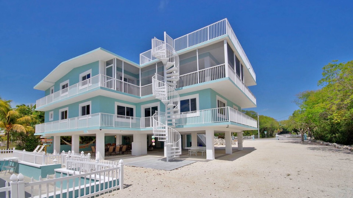 Anglers Park House | Stunning Three Level House on Key Largo Canal with a heated pool and roof deck.