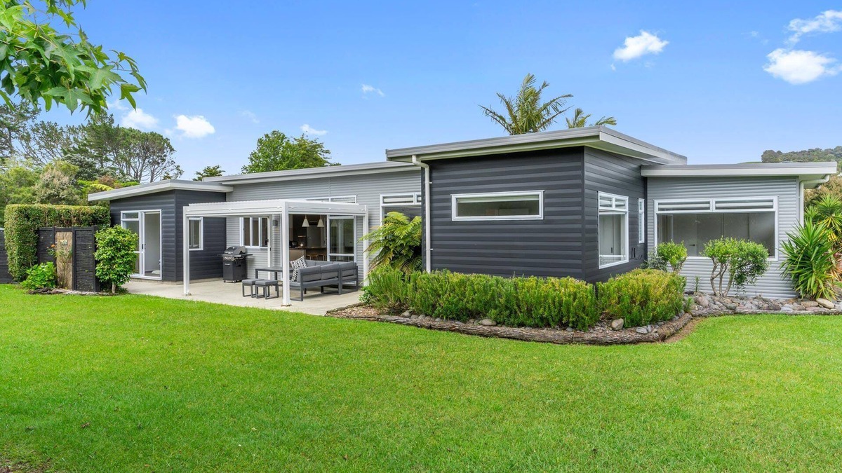 Mangawhai House | Sun Central - Modern, sunny holiday home in tranquil garden setting