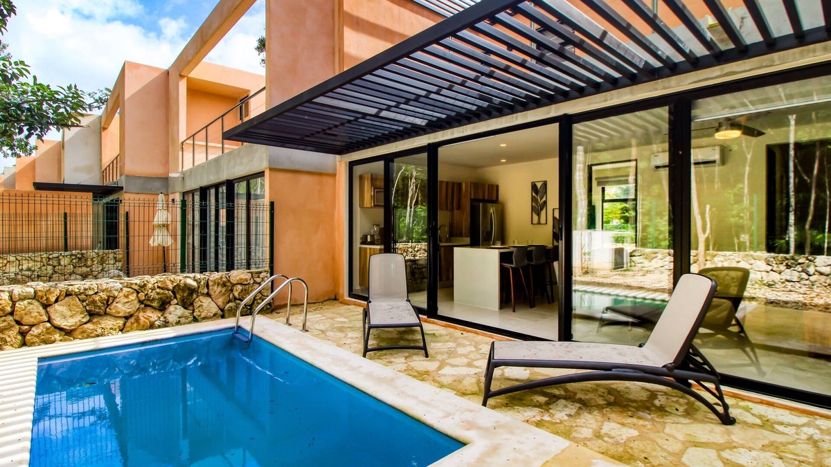 Tulum House | Sun-filled & dog-friendly resort home with outdoor pool, gym, patio, & courts