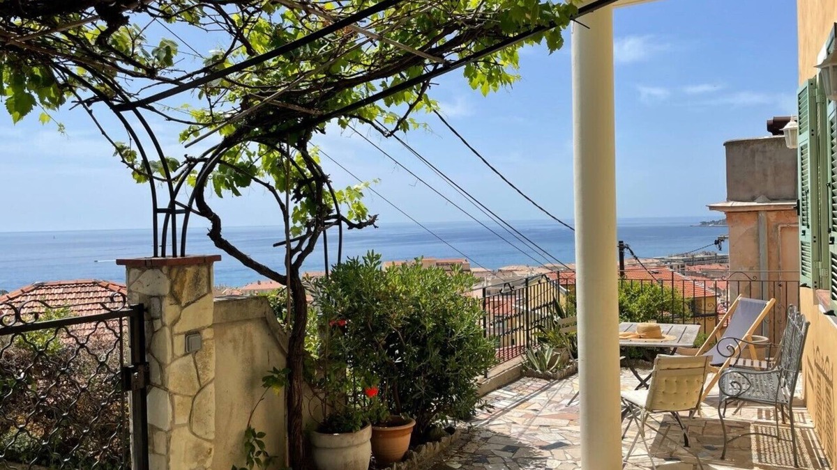 Menton Apartment | Terrace with stunning sea view and pergola with vines