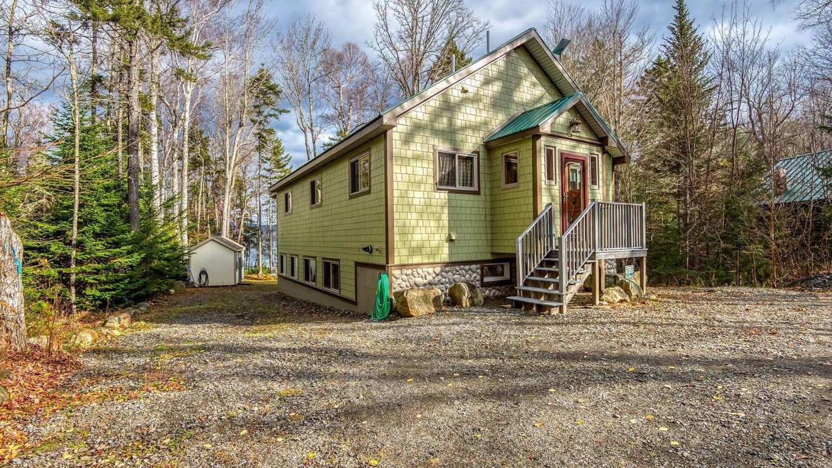 Rangeley House | The 4 Seasons on Mooselookmeguntic Lake with dock, mooring, 4 kayaks, fire pit, and pet friendly!