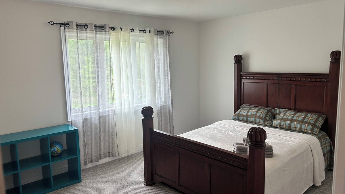 Angus House | The Angus Nest: Master Suite with Jacuzzi, fireplace —perfect for a retreat.