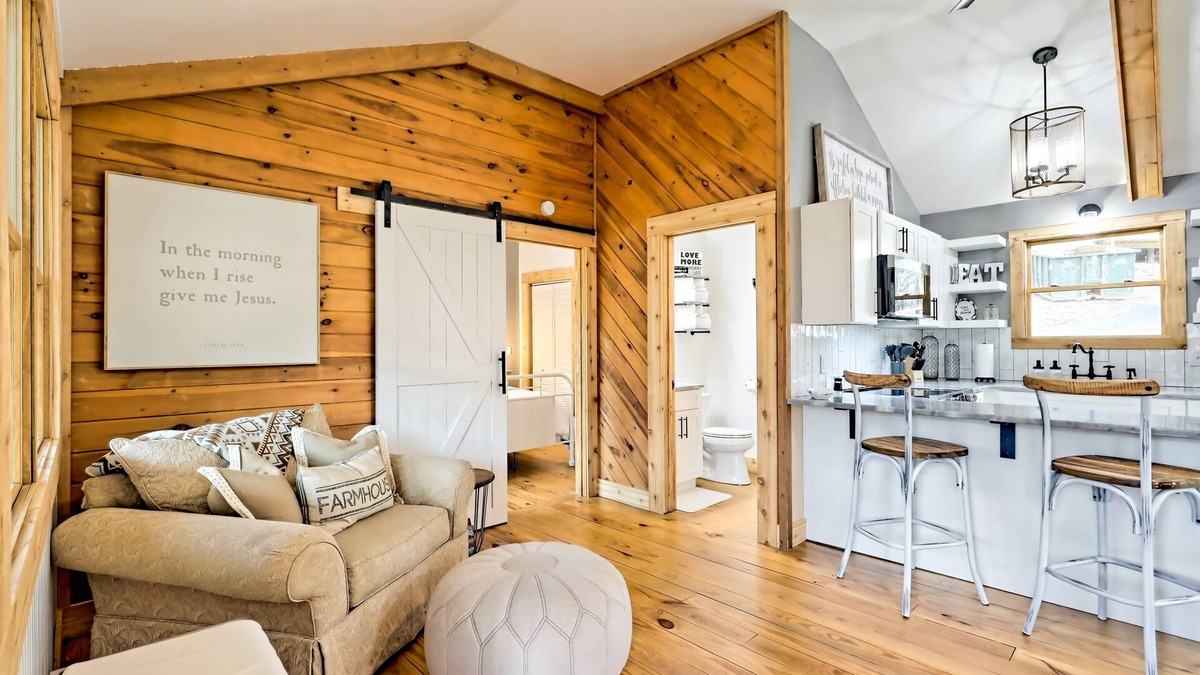 Blairsville Cabin | The Coop | Woodland cabin in Blairsville with wraparound porch & fireplace