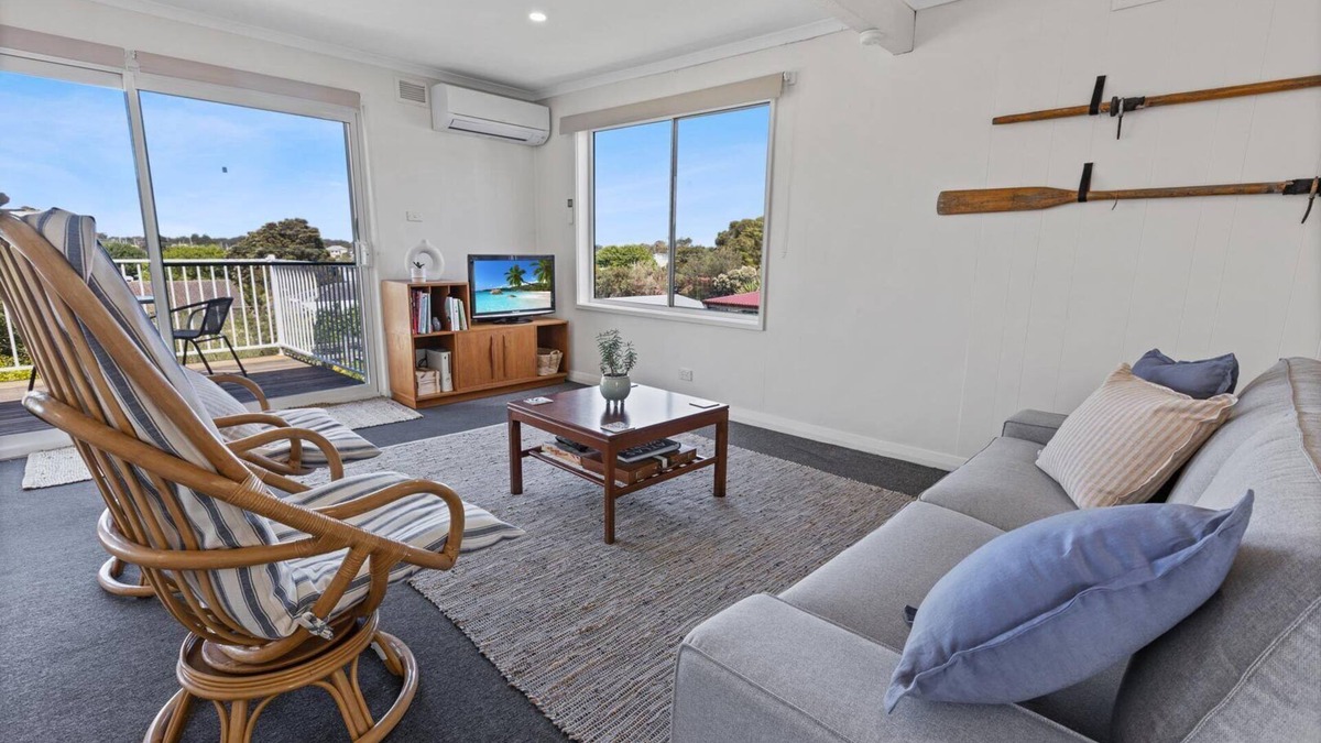 Paynesville House | The Lake Villa - Enjoy views over the treetops of downtown as you relax