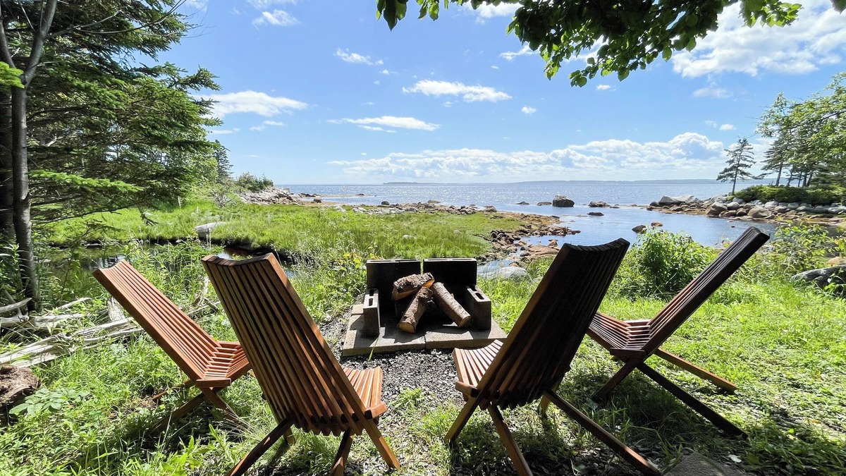 East River Point House | The oceanside Hideaway is nestled between the trees with stunning ocean views