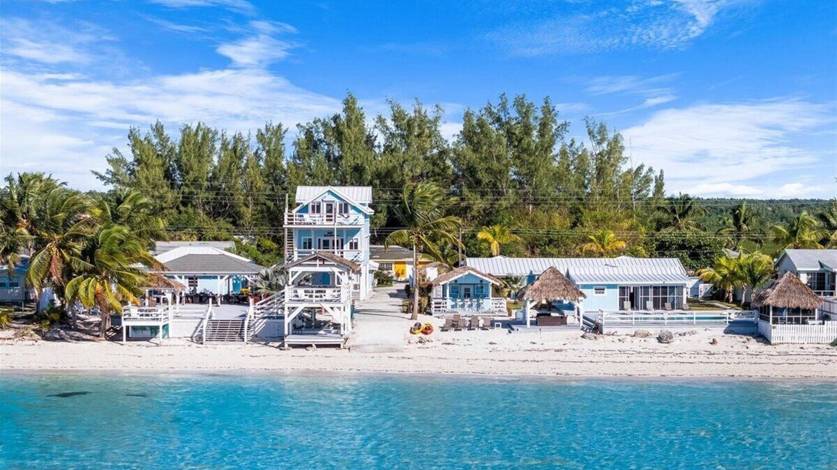 Bahama Palm Shores House | The Paradise. Beachfront property with a pool; accommodates 14 guests.