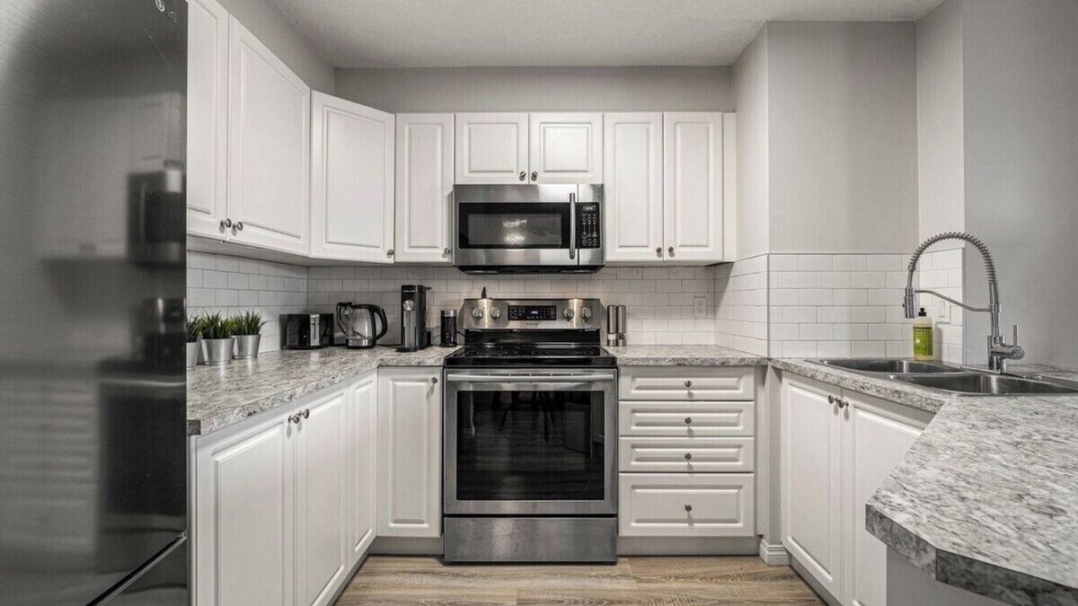 Okotoks Apartment | The Penthouse Balcony Fire Pit BBQ A/C