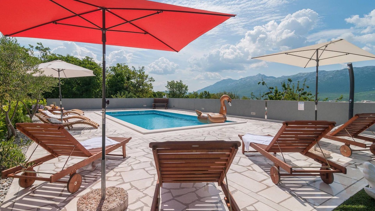 Koprivno House | This comfortable holiday home with pool is situated on a hill surrounded by nature and woodland.