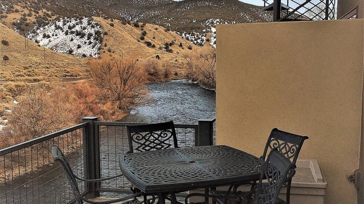 Salida Condo | This riverfront downtown condo boasts and open floor plan for kitchen, living room, and dining areas. Or step onto the balcony over the Arkansas River to hear the water rushing by. Oversized master suite has its own balcony and indoor sitting area.