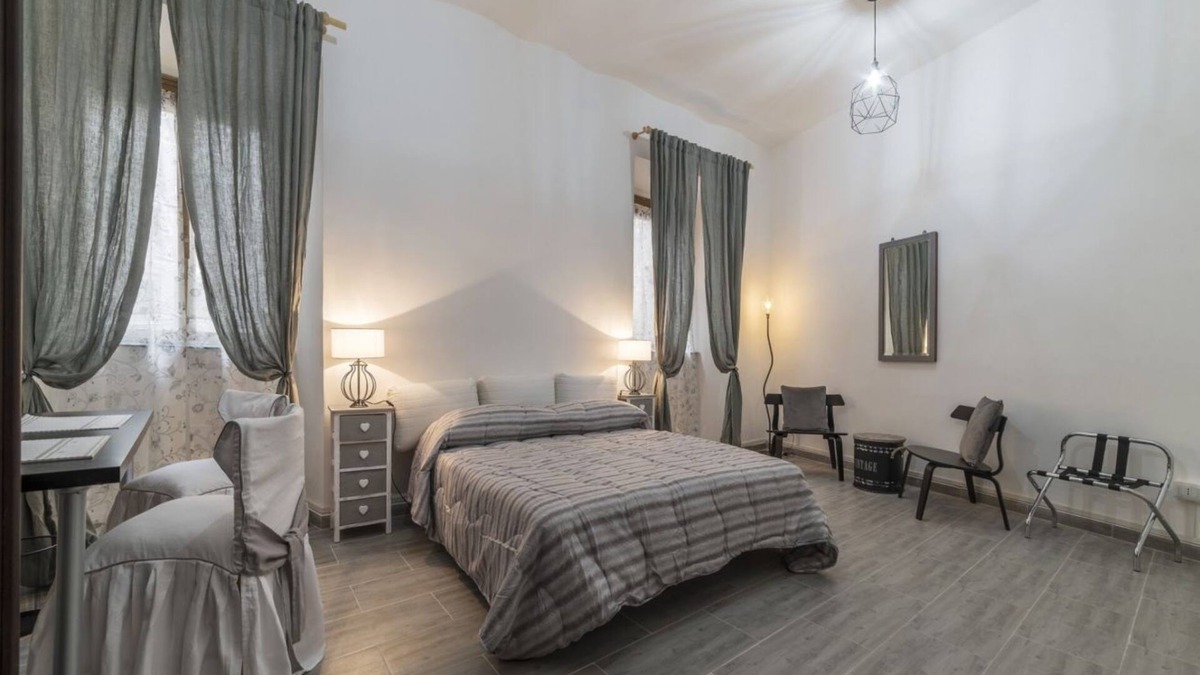 Salario Apartment | This spacious 180sqm apartment with four bedrooms is able to accommodate up to 8 people. Located on the first floor (with elevator) of a restored period building, the apartment overlooks the private park of Villa Albani, one of the most beautiful and pea