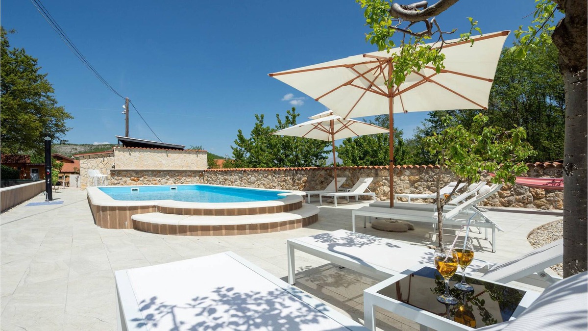 Vrlika House | This vacation home with pool offers you a pleasant stay with views of the mountains and nature.