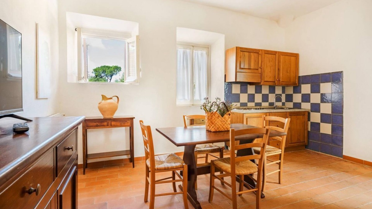 Pian dei Mucini Apartment | Three-room apartment on the ground or first floor in rustic style of approximately 40 m2 furnished in a simple but functional way and located in the village in a large park.It is composed of a living room with sofa and flat-screen television, kitchenette