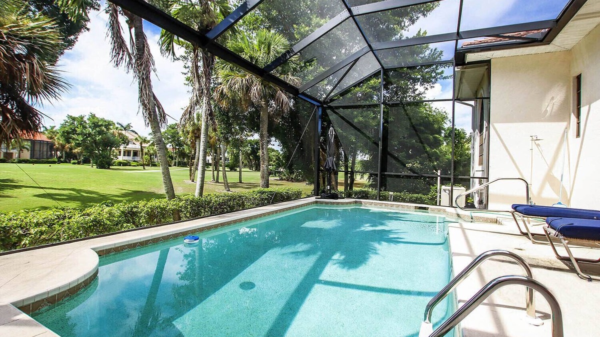 Beachview Country Club Estates House | Tin Cup - Beachview Estates home with pool on golf course