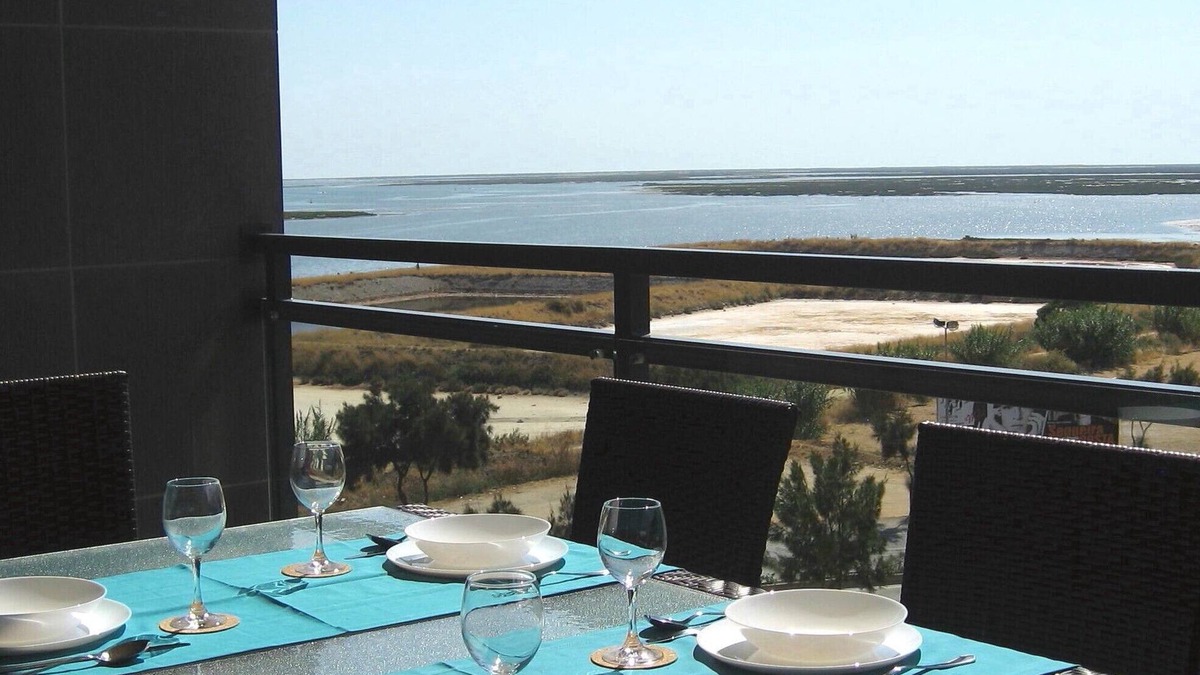Olhao Apartment | Top-floor frontline apartment, sea views, rooftop pool, easy walk historic Olhao