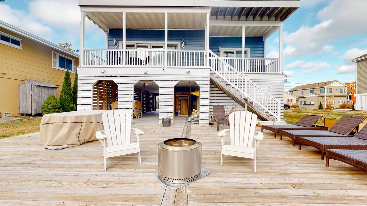 South Bethany Harbor House | Town of South Bethany canal-front home with 2 balconies, firepit, & kayaks