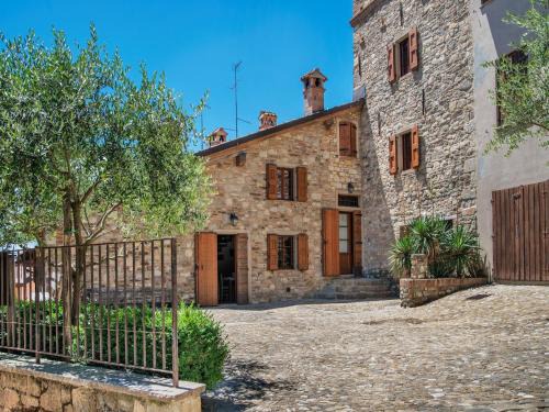 Ca' de' Grimaldi House | Tranquil Village Stay with Fireplace