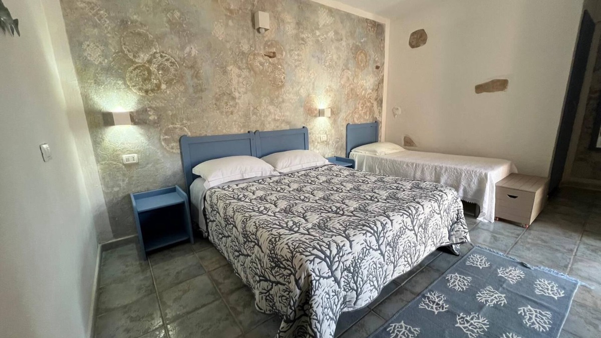 Gonnesa Apartment | Triple room with shared pool and kitchen, Wi-Fi and air conditioning