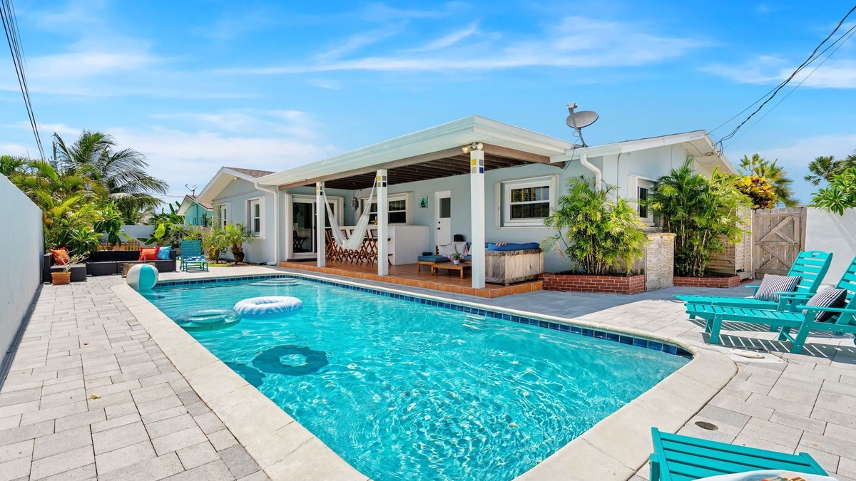 Seacoast Shores House | Tropical Retreat: Indian Harbour Beach Home with BBQ Grill, Fire Pit, Private Pool & Hot Tub! 🌴