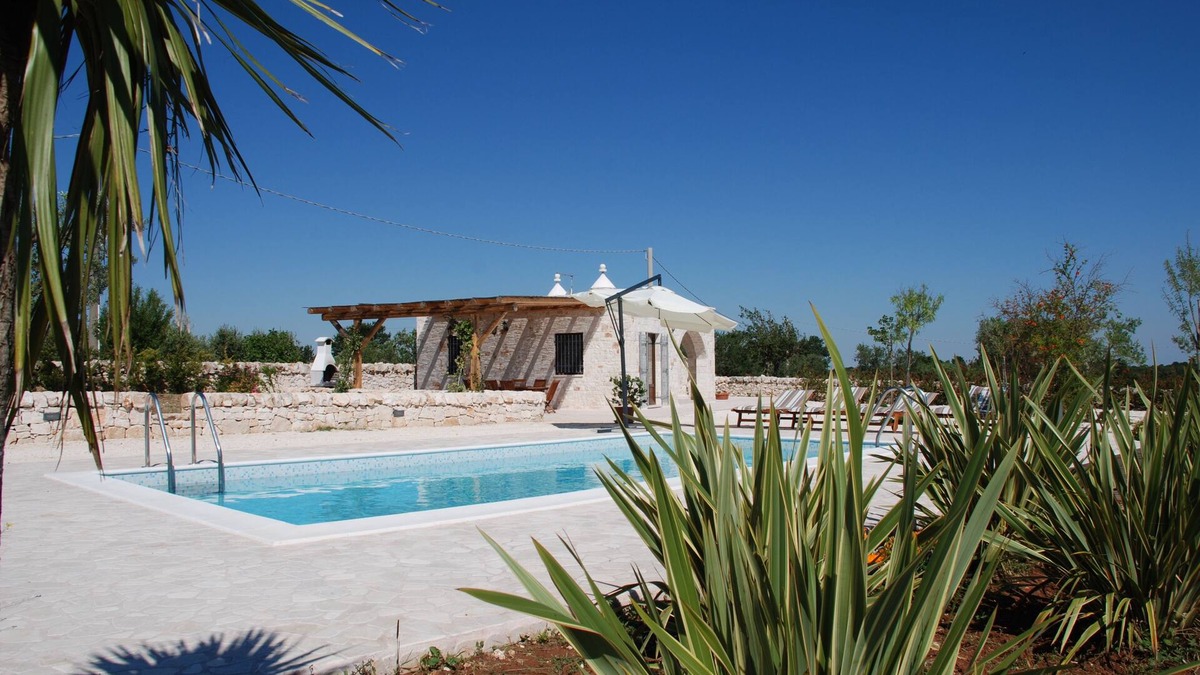 Alberobello Villa | Trulli Bianchi. Characteristic stone trullo with private pool and panoramic view
