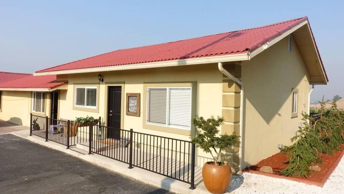 Talent Apartment | Two cottages with king bed bedrooms, dining area and full kitchen.