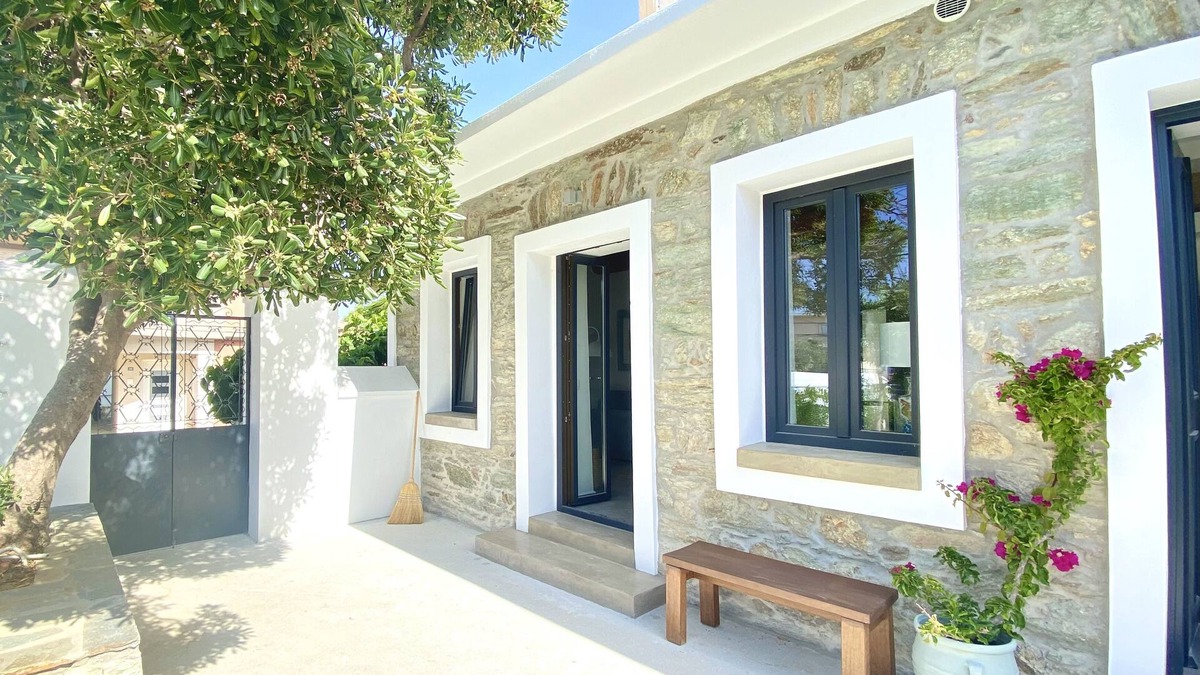 Karystos House | Urban Oasis: Stone House with pool & garden